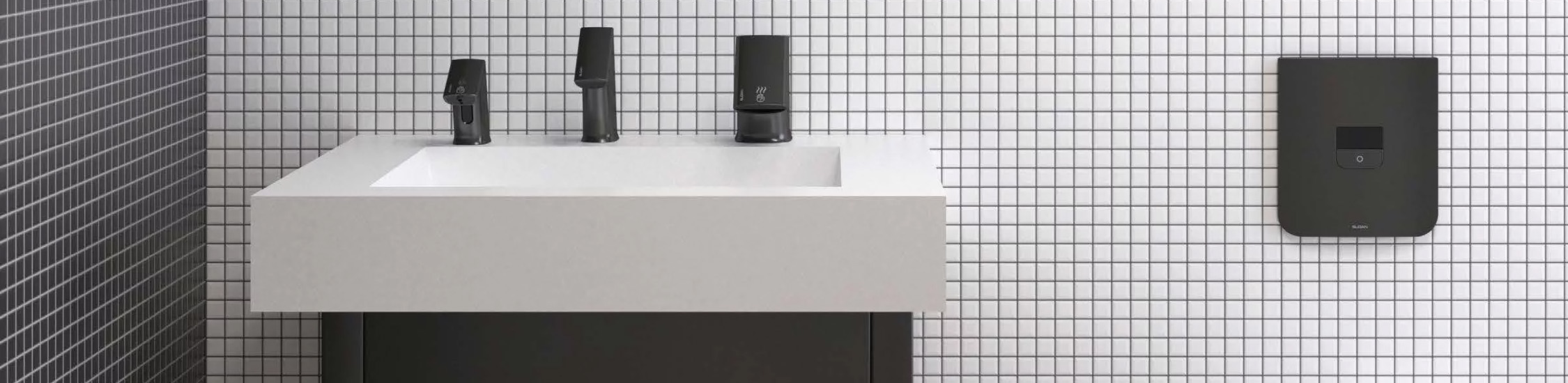 an elegant restroom featuring Sloan’s modern, minimalist finishes. With a sleek rectangular sink, matte black faucet, and wall-mounted white urinal, the space blends materials such as wood and ceramic to create a sophisticated, clean, and contemporary atmosphere.