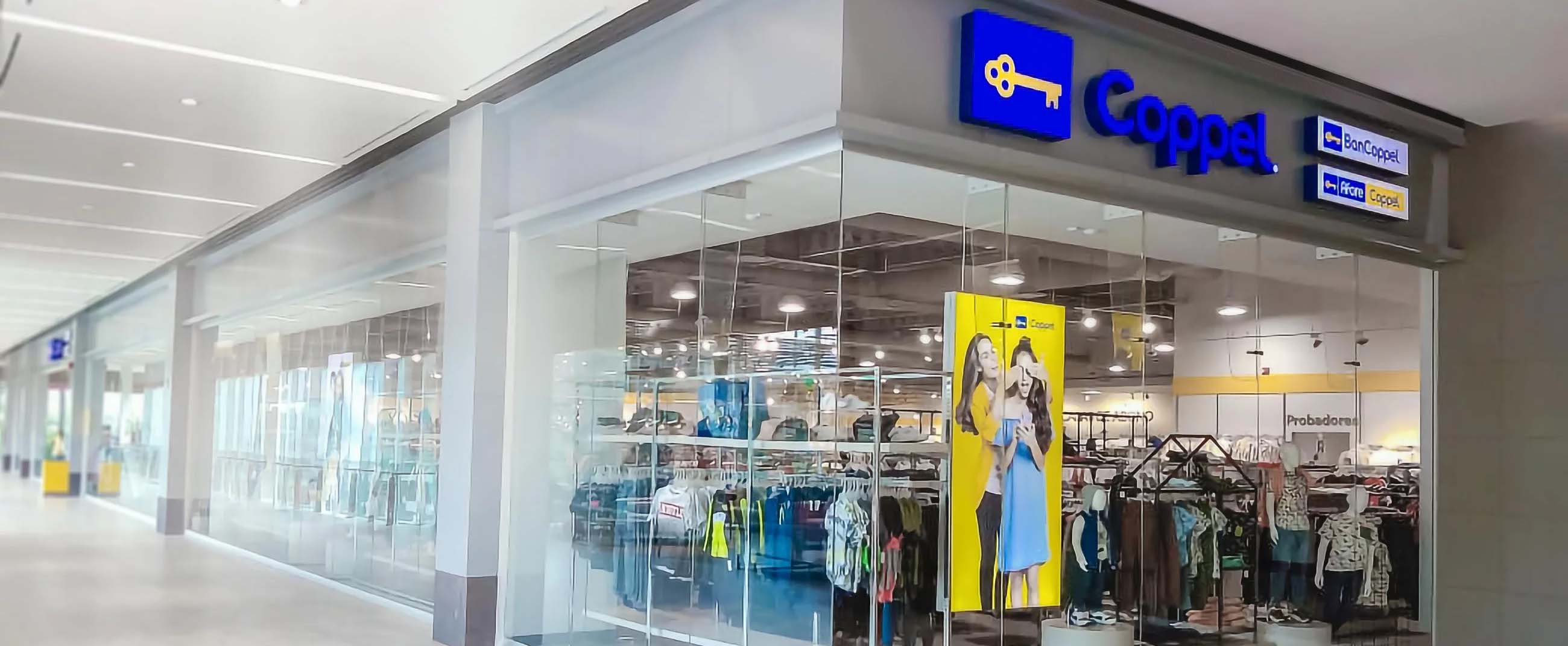 Coppel store located inside a modern shopping mall. The storefront features a transparent glass façade that reveals a bright interior with neatly arranged clothing and accessory sections.