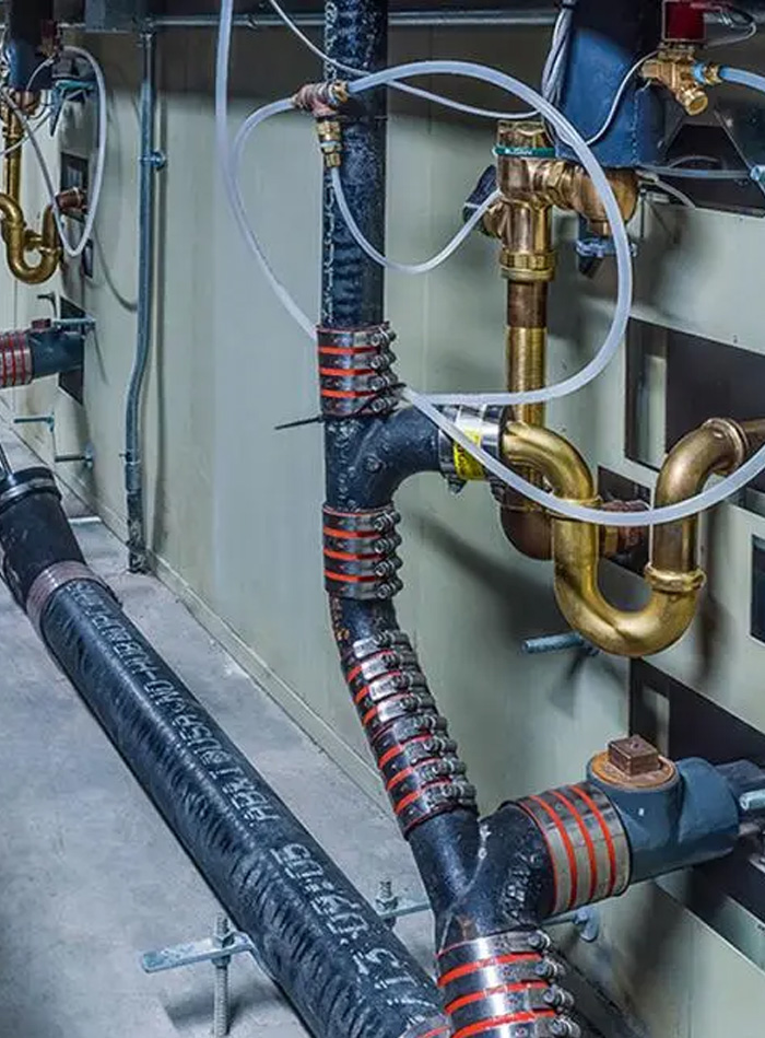 detailed hydraulic installation inside the Stanton Correctional Facility, featuring water supply and return lines with their respective valves, insulation, and fittings.