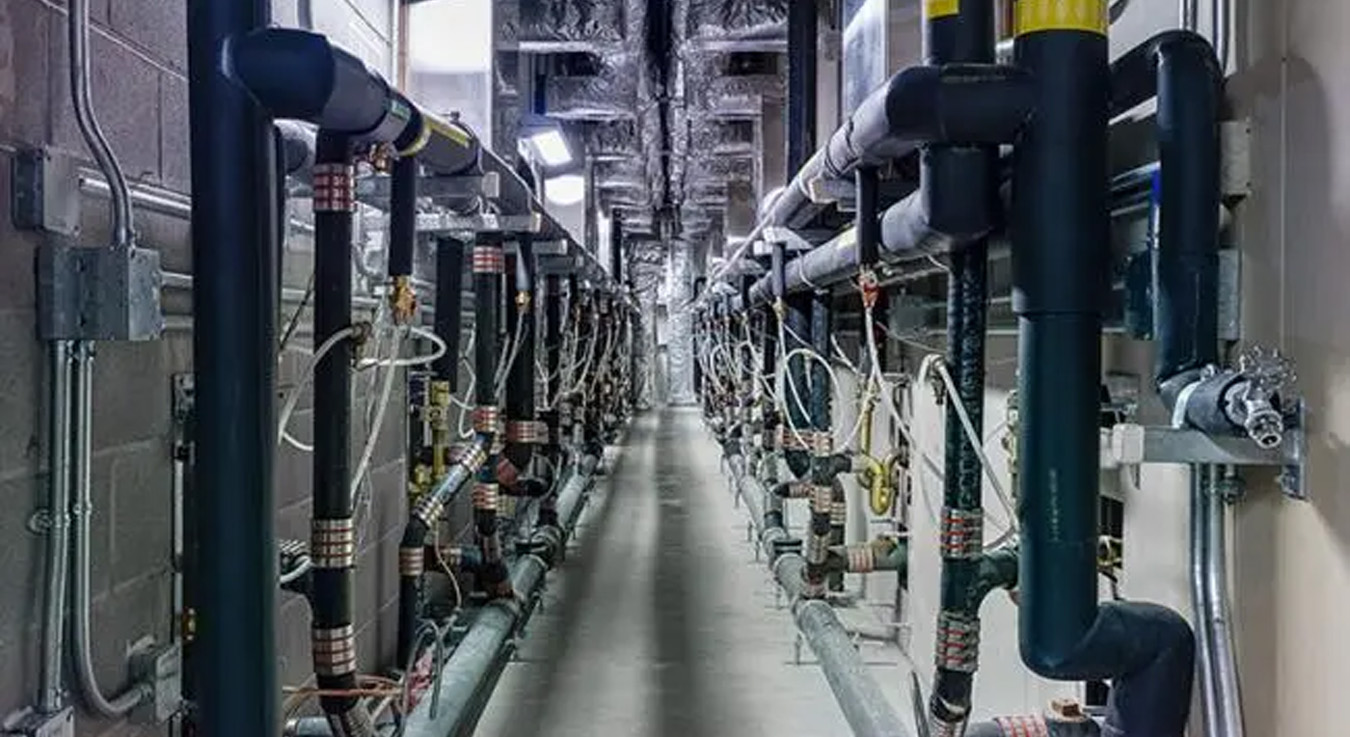 the mechanical and plumbing distribution room at the Stanton Correctional Facility, where the building’s water and drainage systems are centralized.