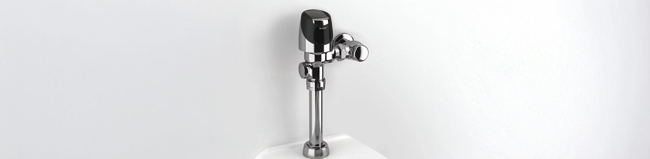 the Sloan® Flushometer, an icon of modern hydraulic engineering. Its chrome-plated, durable design embodies reliability, precision, and water efficiency
