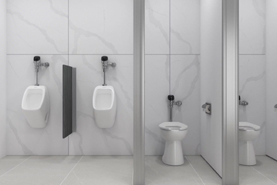 The wall-mounted urinals and toilets are fitted with Sloan® chrome flushometers, optimizing space and ensuring easy maintenance.