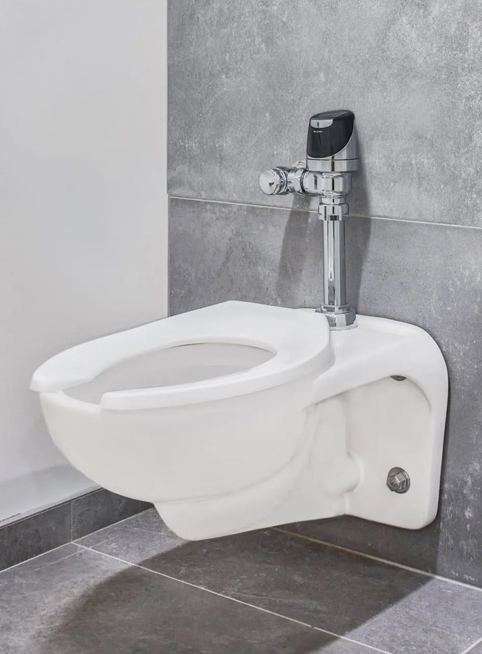a Sloan wall-mounted toilet fitted with an automatic sensor flushometer. The design offers water efficiency, touch-free hygiene, and easy maintenance, ideal for modern and sustainable facilities.