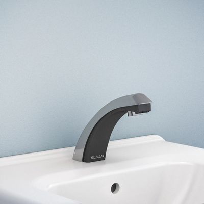 Sloan automatic faucet with sleek black-and-chrome curved design, installed on a white sink with light blue background.
