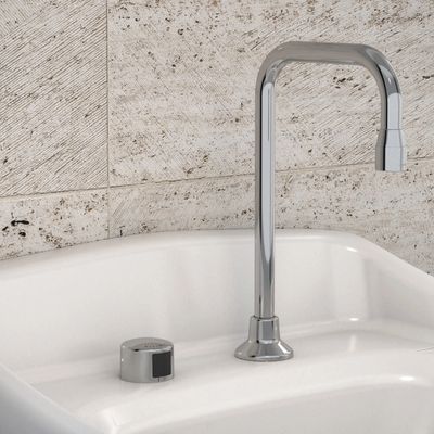 Sloan high-arc automatic faucet in polished chrome, installed on a white sink with beige tiled backsplash.