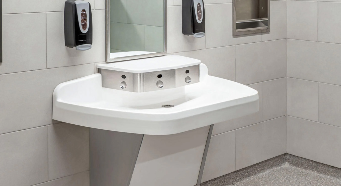 Sloan integrated sink system installed at Keith Bell Opportunity Central (The OC). This all-in-one station combines a sensor-activated faucet, soap dispenser, and hand dryer, offering a streamlined, touch-free experience.