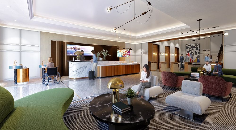 Modern and accessible lobby with a marble reception desk, stylish seating areas, and people interacting, including a woman in a wheelchair.