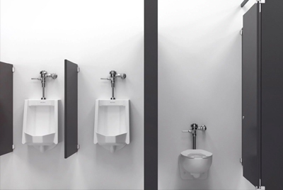 The wall-mounted urinals and toilets are fitted with Sloan® chrome flushometers, optimizing space and ensuring easy maintenance