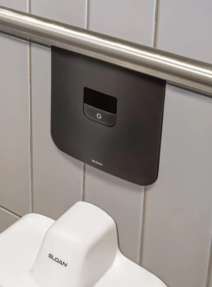 a close-up of a Sloan concealed electronic flushometer, installed at SPC Mechanical Headquarters.