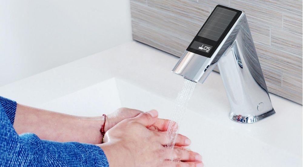 Hands washing under Sloan solar-powered touchless faucet