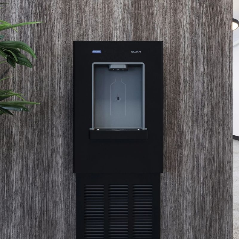 Black Sloan bottle filler installed on a wood-finished wall in a modern indoor space.