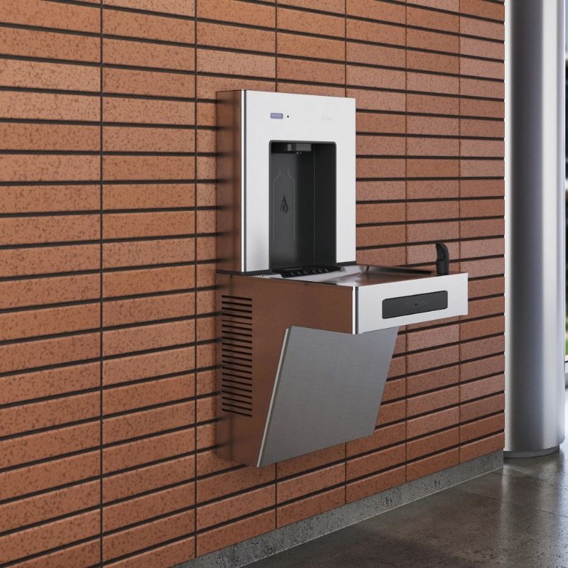 Sloan drinking fountain with integrated bottle filler mounted on a modern brick wall.