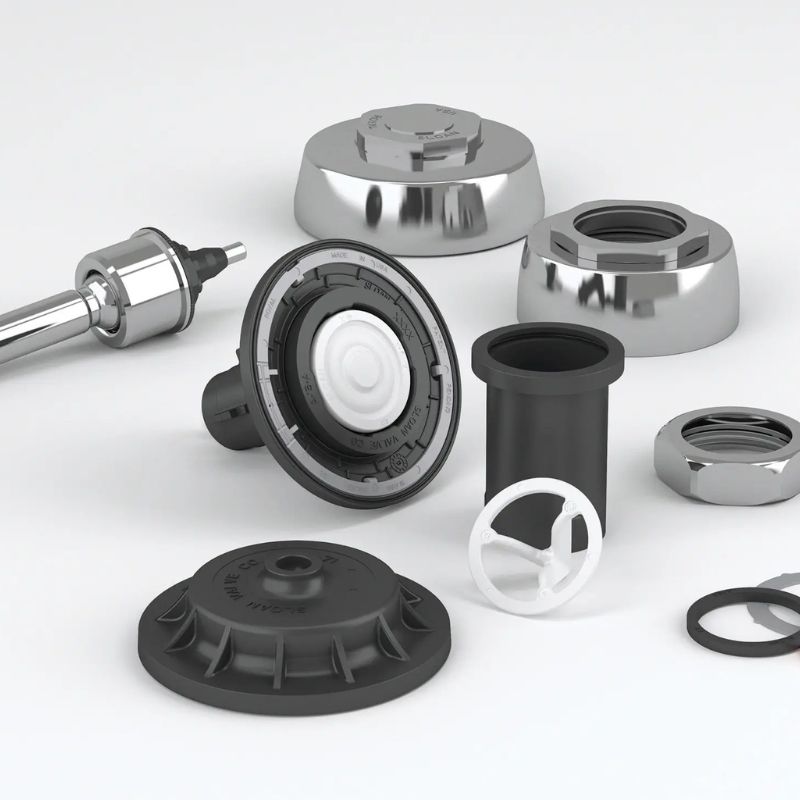 Disassembled Sloan flushometer internal components, including diaphragm, gaskets, nuts, and parts in chrome and black plastic finishes.