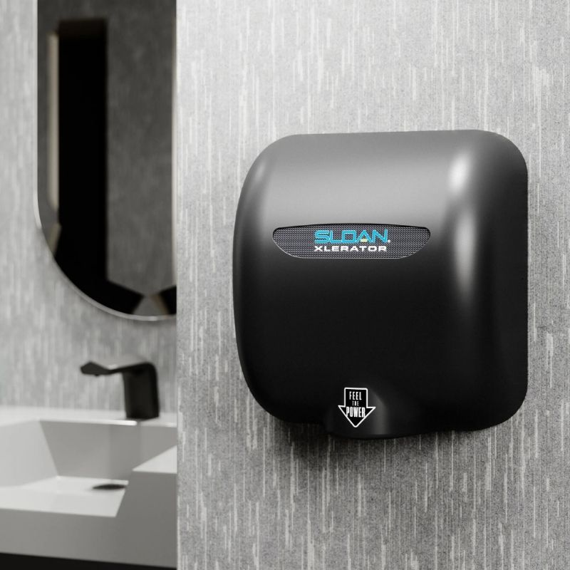 Black Sloan XLERATOR hand dryer installed in a modern restroom with a textured wall and contemporary sink.