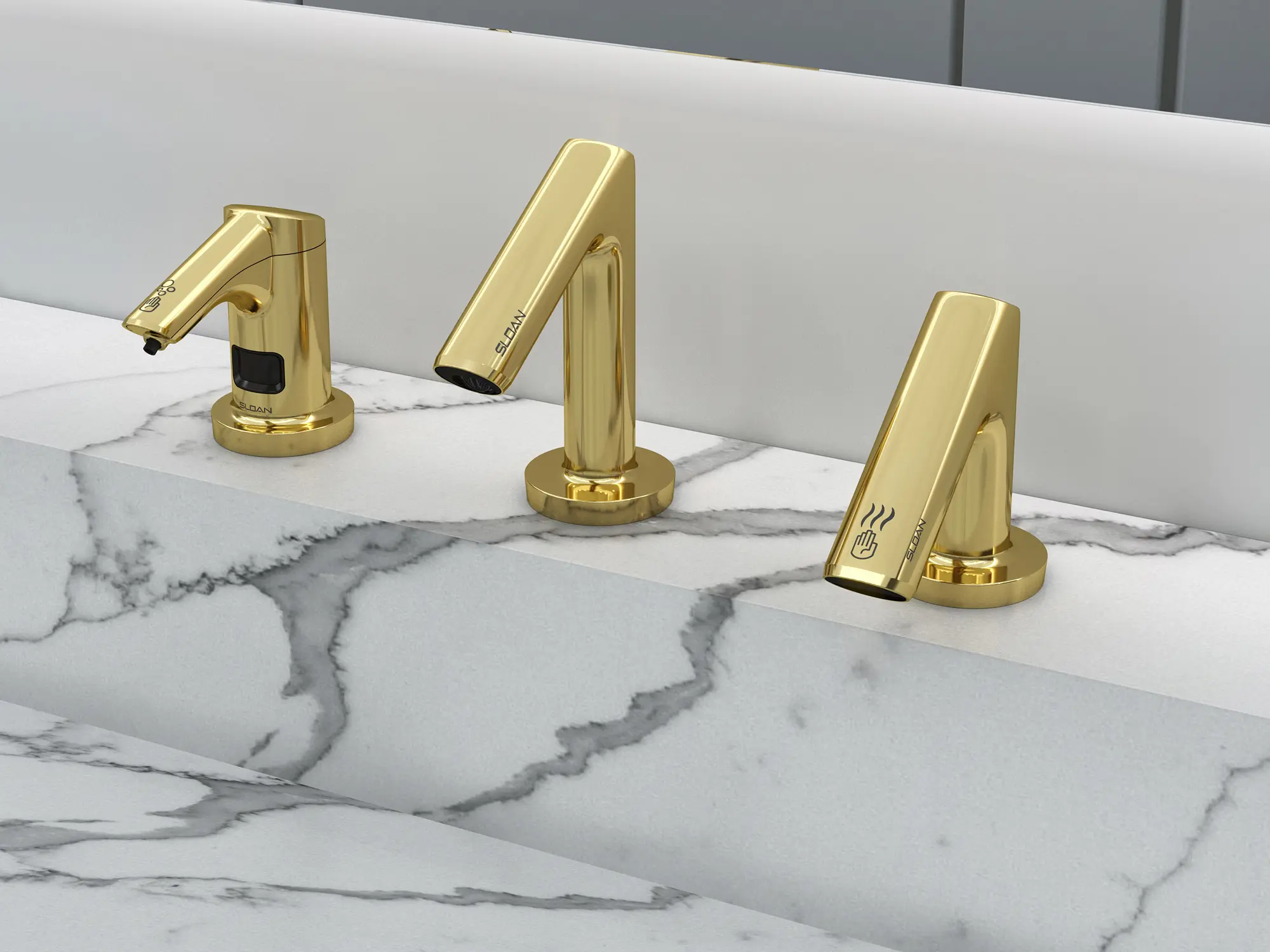 Sloan sensor-activated faucet and hand dryer set in polished brass finish, installed on a white marble countertop.
