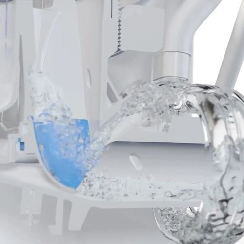 Close-up of water flow inside a Sloan toilet, showing the power and efficiency of the flush in action.