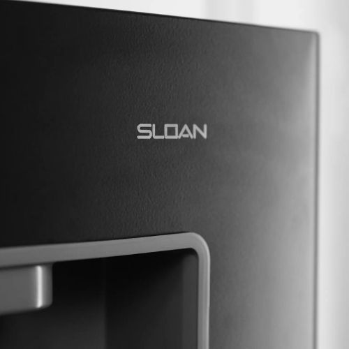 Close-up of the Sloan logo on a black water dispenser.