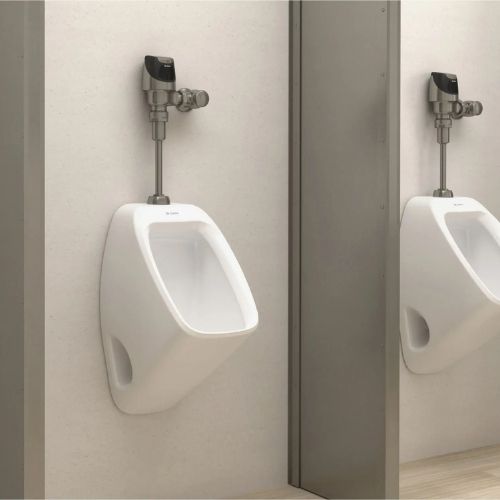 Single Sloan urinal with a sensor-operated flushometer installed on a light-colored wall.