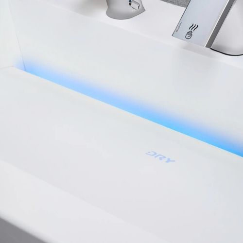 Lavabo con zona de secado integrada iluminada con luz azul y grifo automático, que muestra la palabra “DRY” en la superficie.