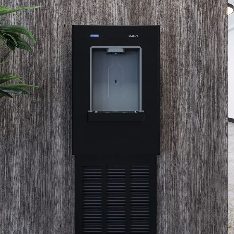 Black Sloan wall-mounted water dispenser integrated into a modern wood-paneled wall.