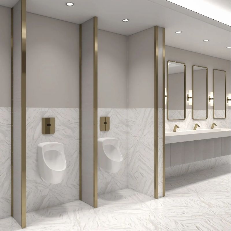 Elegant restroom with Sloan gold touchless fixtures and urinals