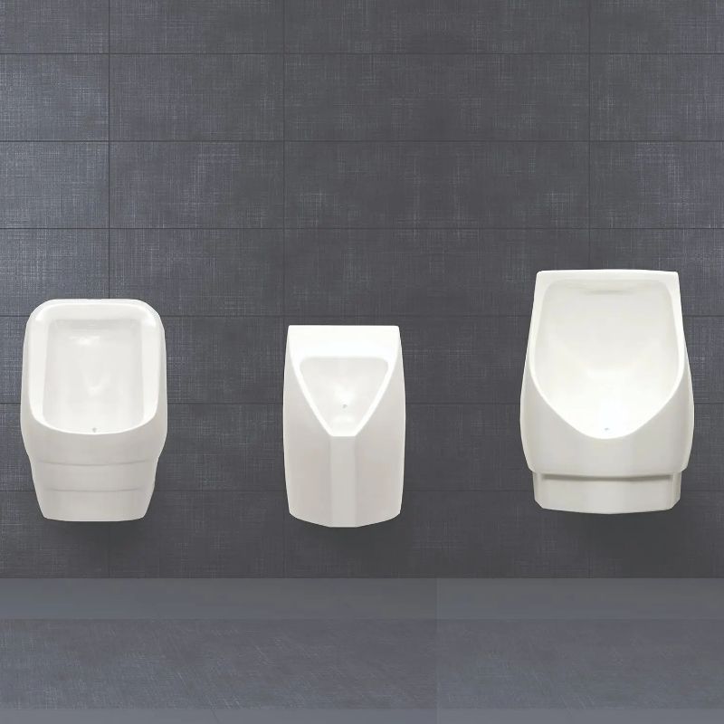 Three Sloan urinals in different models and sizes installed against a dark tiled wall.