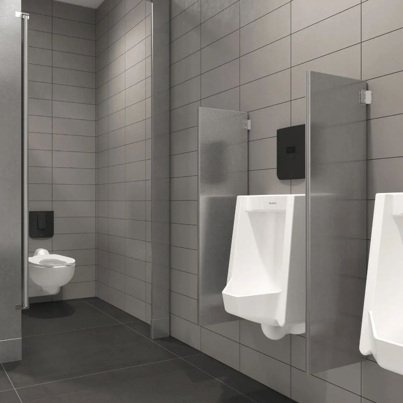 Modern restroom with Sloan black touchless flushometers