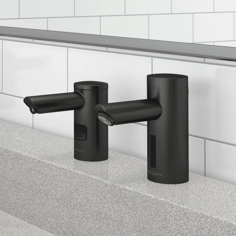Sloan matte black touchless faucets on terrazzo sink
