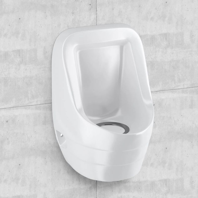 Sloan white porcelain touch-free urinal installed on a light gray concrete wall.