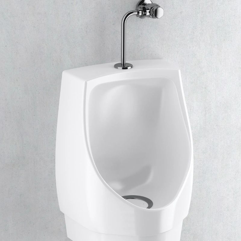Sloan white porcelain urinal with manual flushometer in polished chrome finish installed on a light gray wall.