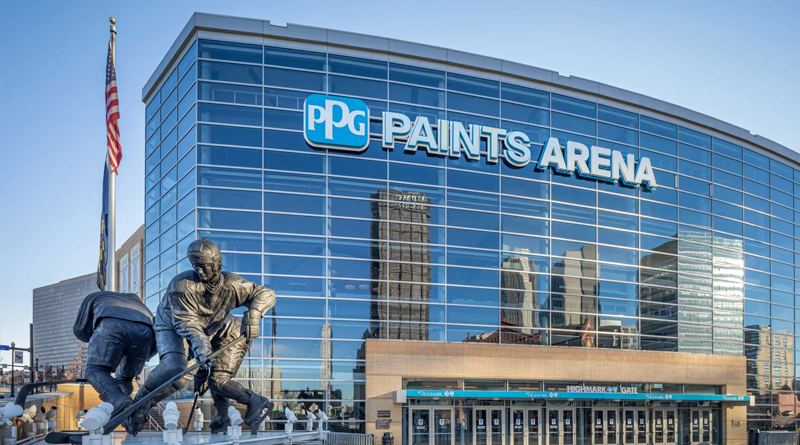impressive façade of PPG Paints Arena in Pittsburgh, Pennsylvania, a modern venue known for hosting sports events, concerts, and large-scale performances. Its curved glass and steel structure reflects the city skyline, while the statues at the entrance pay tribute to hockey, one of Pittsburgh’s most iconic sports.